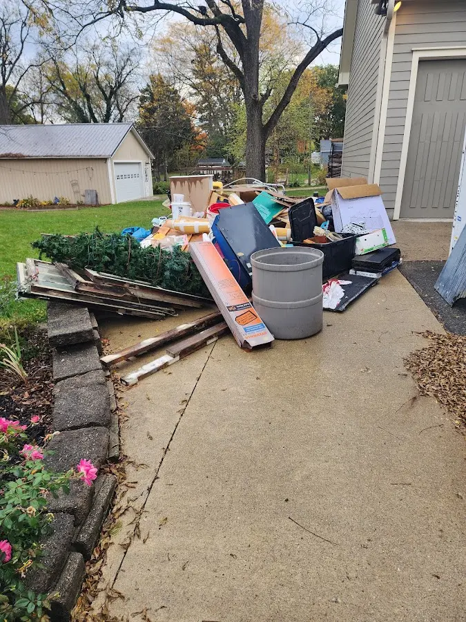 Dumpster being loaded with debris for Commercial Dumpster Rental in Lake Luzerne